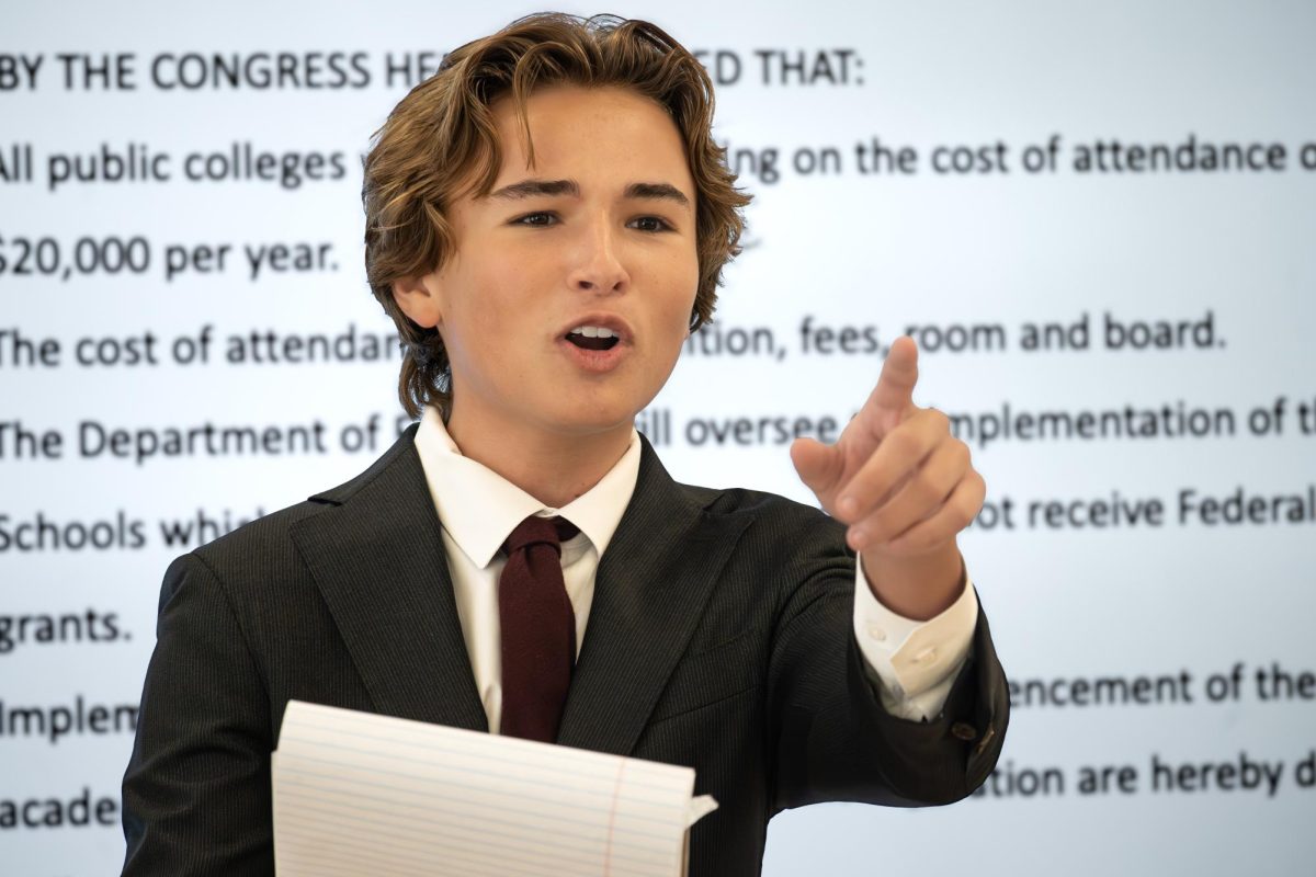 Presenting a deliberation over a bill concerning tuition costs for public universities, communications sophomore Grayson Murray responds to examination refuting his argument. “Speakeasy gives us (debate students) a great platform to showcase to our parents how Congress can be light-hearted and how our team is a community,” Murray said.