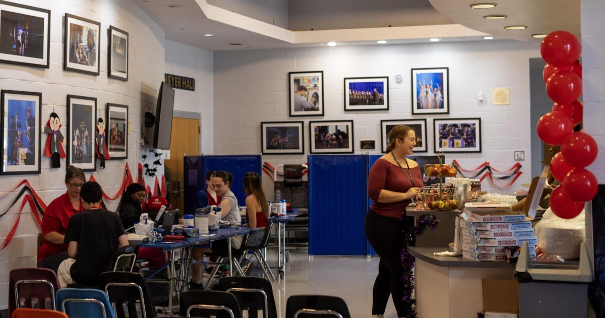 Getting their vitals checked and setting up a food stand, students participate in the first blood drive of the year. This event provides a life-saving resource for those in need, while fostering community connections.