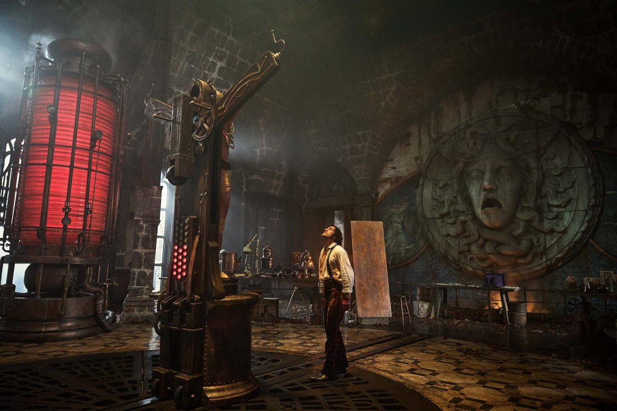 A shot from the movie in an official trailer, showing the creature positioned in the laboratory as though he were crucified.