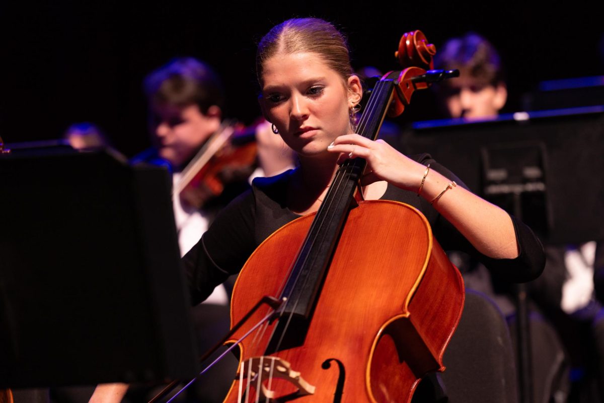Playing “What Child Is This?”, strings sophomore Aislinn O’Brien performs on a cello. “Prism allows students to see the efforts and skills of the music department,” O’Brien said. “Instead of seeing just your major, you can see the other majors in the music department and how their work ethic varies with their teachers and conductors.”