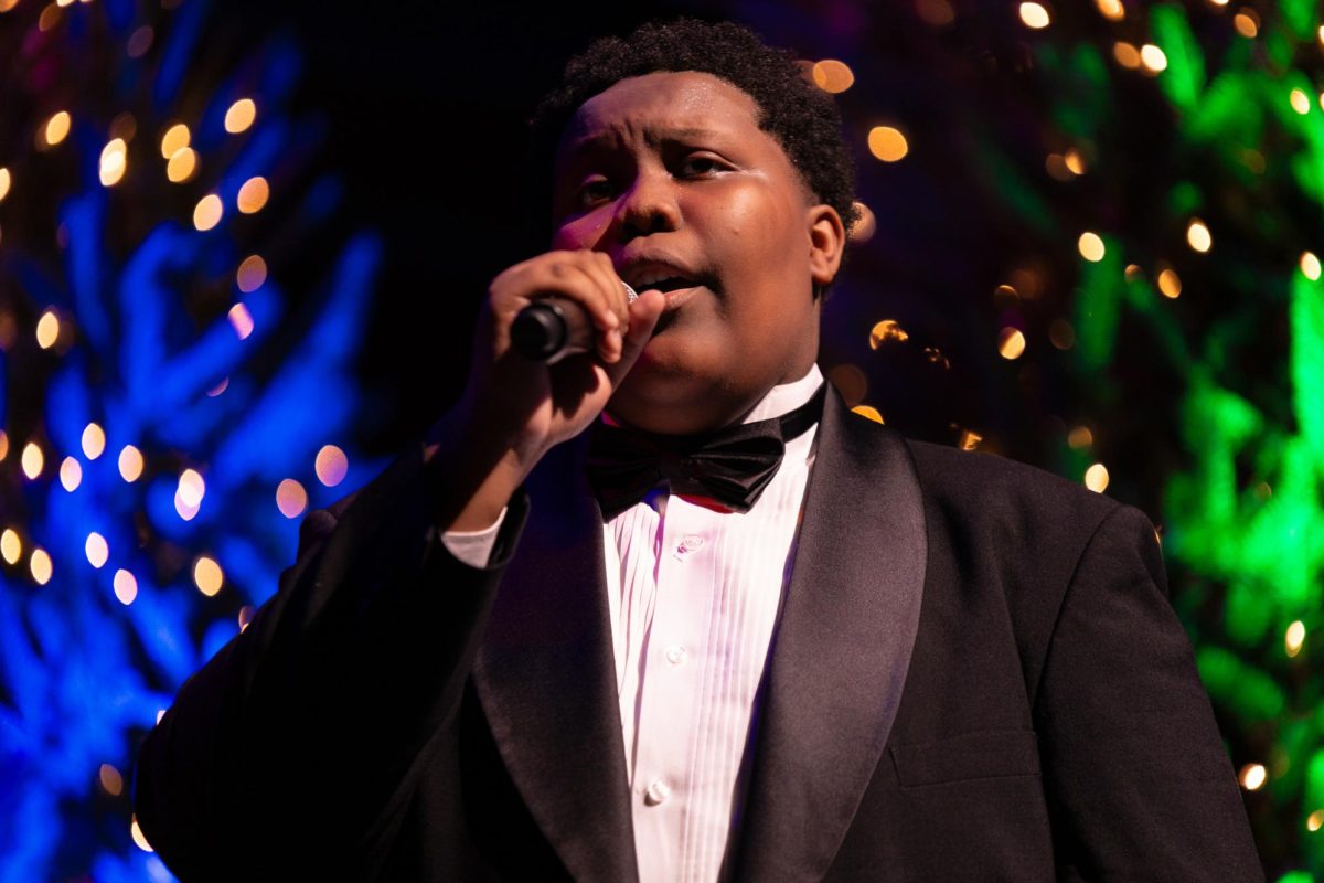 Singing “The Son of Mary” by Harry Belafonte, vocal senior Daniel Jones sings his solo as part of his trio of singers. (Landon D'Alessandro)