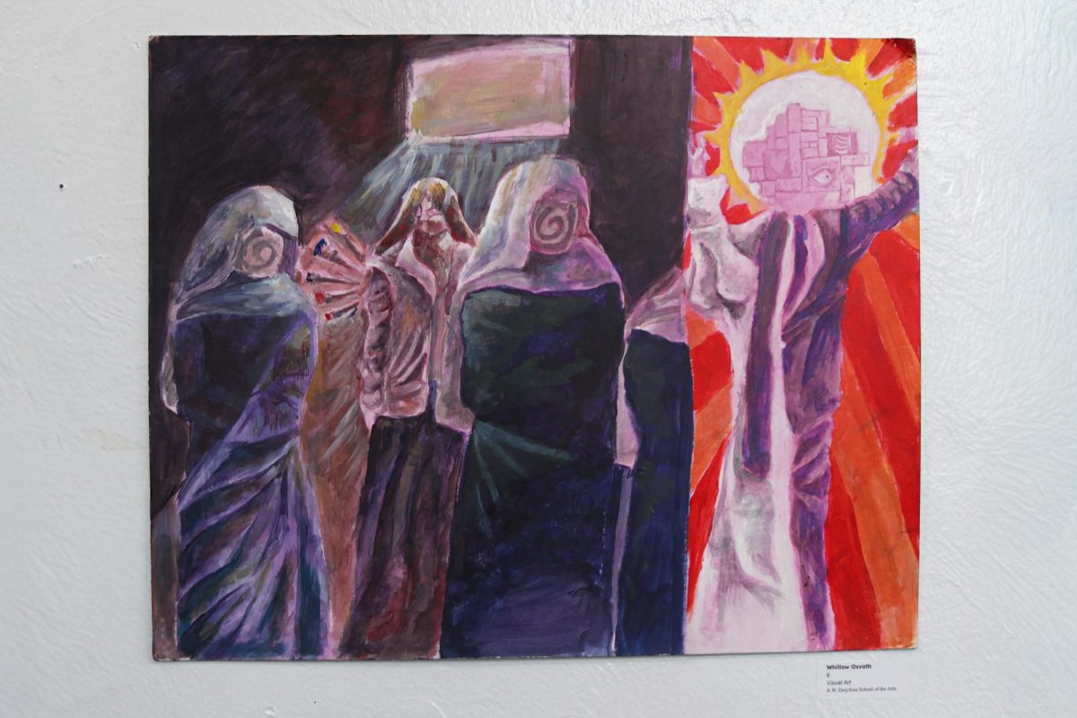 Visual freshman Whillow Osvath’s piece hangs on a wall in Building 2. Osvath placed many political and personal references throughout the piece, describing it as an “expression of Florida.” “The God that these people are worshiping (in the painting) has a Catholic robe, and the other half is a politician,” Osvash said. “It is supposed to represent how, where I used to live, a lot of people idolized politicians, and how they kind of treated them like a god.”