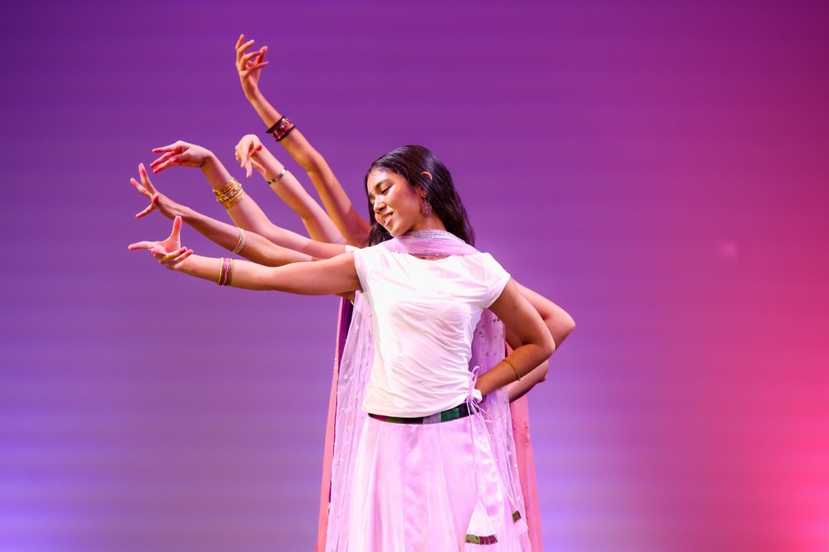 Leading a layered arm movement, Asian Cultural Society (ACS) president and piano junior Eva Basnet begins the first ACS performance of the Multicultural Show. ACS’s performances consisted of cultural pieces from Bangladesh, the Phillipines, India, and China.