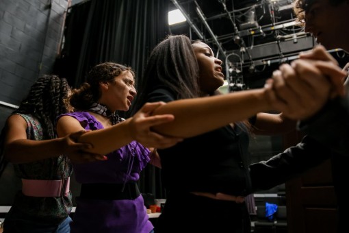 Theatre sophomore Lillian Jones, theatre freshman Samantha Marchena, and theatre junior Olivia Bynum link arms during rehearsal of “Dentist!”