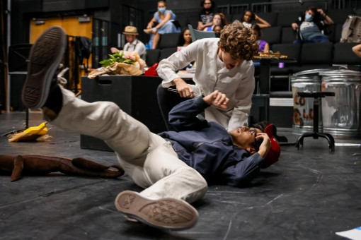 In “Now (It’s Just the Gas),” theatre senior Ryan Lamontagne pulls theatre junior Juan Rivera to the floor to examine his teeth.