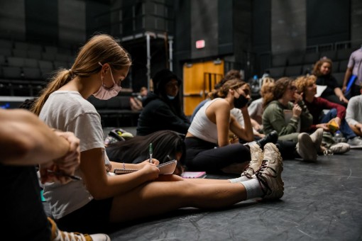 After running through the show with costumes for the first time, theatre senior Grace Trainor takes notes as Mr. Swan critiques her technique during the show.