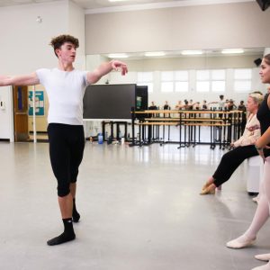 As students watch the last group of dancers before the break, dance senior Mario Merry finishes the exercise. Most of the class was spent practicing combinations in groups. “I definitely think we’ll become more like a community,” Jette said. “We almost always share a common goal.”