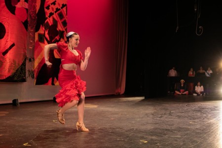 Swaying with the music, dance junior Gabriela Tatum performs a Cuban salsa dance during the Multicultural Show.