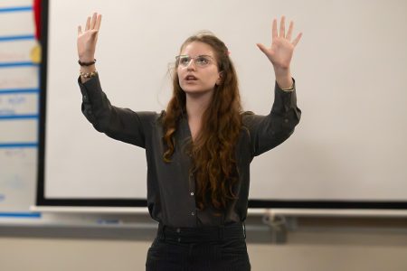 Performing a dramatic retelling of Joan Lingards' novel “Across the Barricades,” communications junior Sara Lipnitzky uses large gestures to emphasize the emotional and humorous nature of the source material for her interpretive event.