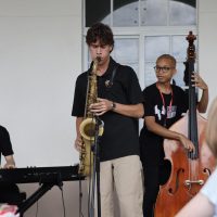 Playing the saxophone, band senior Daniel Goodwin performs as part of the band, The Brothers Five, Wednesday, Oct. 29 at lunch