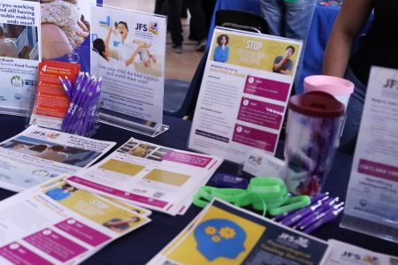 Pamphlets adorn the table at the Jewish Family Service booth at the mental health expo.