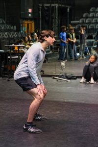 Practicing the choreography of a scene, theatre sophomore Max Leighton participates in a blocking workshop before the spring production. Musical theatre dance teacher Sandra Christie led the workshop, she critiqued the dance and provided new movements to add to the scene.