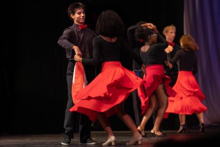 Dancing to “La Negra Tiene Tumbao” by Celia Cruz, dance junior Patrick Richardson and theatre junior Sade Leandre perform a salsa number for the Caribbean Heritage Club (CHC) portions of the Multicultural Show.