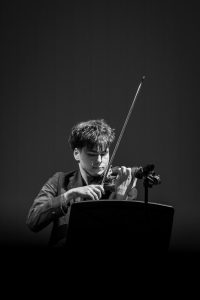 Playing a rendition of “Theme from Schindler’s List,” strings junior Samuel Schear performs during Jewish Student Union’s (JSU) portion of the annual multicultural showcase. “Schindler’s List,” an Academy Award-winning film, depicts the persecution of Jewish people during the Holocaust.