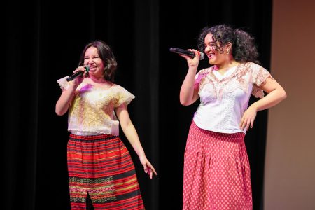 Singing a rendition of “Runaway Baby” by Bruno Mars, vocal senior Sage Duke and piano senior Micah Sachsenheimer smile together while performing. Duke and Sachsenheimer’s performance accompanied Asian Cultural Society’s (ACS) tinikling piece, a traditional Filipino dance that involves jumping over rapidly clapping bamboo poles.