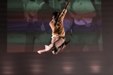Jumping into the air, theatre sophomore Jonathan Williams dances to “Change Is Gonna Come,” by Al Green as a solo Black Student Union (BSU) performance. Williams’s performance was accompanied by projected imagery of moments in African American history, including pictures of Martin Luther King Jr., Malcolm Little, and George Floyd.