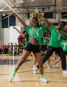 Pointing in the air, theatre sophomore Kourtnee Allen shuffles on the gym floor during the sophomore Pep Rally dance. Allen performed in two Pep Rally dances: the sophomore Pep Rally dance and the cheer performance. “This is my first year at Dreyfoos, and before both of my performances, I felt like I hadn’t made much of an impact on the school,” Allen said. “So when I had the opportunity to be in both dances, I took it.”