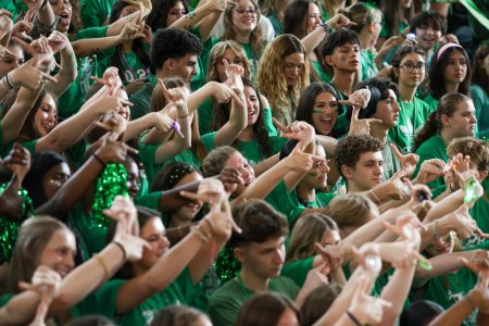 Making a “Z” with their fingers, representing their class’s theme of “Zombies,” the sophomore class poses in the Pep Rally.